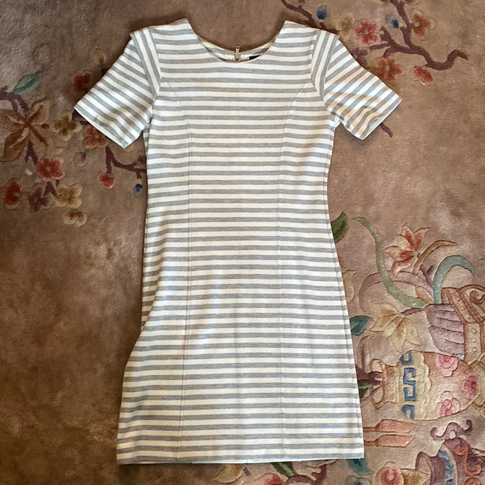 Form fitting French connection dress in cream and gray striped.